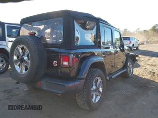 2021 Jeep Wrangler Unlimited Sahara with VIN 1C4HJXEN4MW714133, listed as a IAAI auction lot 41241040 with 82,247 mi miles and . Bid and sale history available at DreamBid. Image 4.