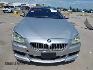 2015 BMW 6 Series 650i z VIN WBA6B2C55FGB99196, wystawiony jako IAAI lot #42107698 z przebiegiem 74 393 mil mil oraz . Historia ofert i sprzedaży dostępna na DreamBid. Obrazek 13.