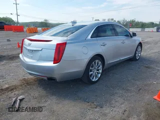 2016 Cadillac XTS Luxury Collection z VIN 2G61M5S33G9107107, wystawiony jako IAAI lot #42072608 z przebiegiem 130 542 mil mil oraz . Historia ofert i sprzedaży dostępna na DreamBid. Obrazek 4.