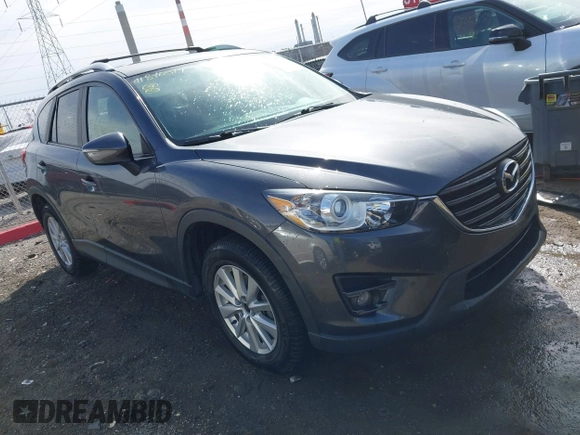 2016 Mazda CX-5 Touring with VIN JM3KE4CY9G0915305, listed as a IAAI auction lot 41840519 with 188,702 mi miles and . Bid and sale history available at carsss.com. Image 1.