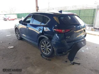 2021 Mazda CX-5 Grand Touring Reserve with VIN JM3KFBAY7M0466156, listed as a IAAI auction lot 41931407 with 55,136 mi miles. Bid and sale history available at carsss.com. Image 3.