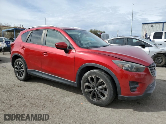 2016 Mazda CX-5 Grand Touring with VIN JM3KE4DY0G0820954, listed as a Copart auction lot 48027785 with 152,448 mi miles and Salvage Title. Bid and sale history available at carsss.com. Image 4.