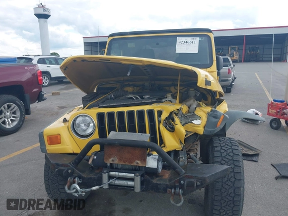 2005 Jeep Wrangler SE z VIN 1J4FA29S95P373313, wystawiony jako IAAI lot #42340611 z przebiegiem 162 801 mil mil oraz . Historia ofert i sprzedaży dostępna na DreamBid. Obrazek 12.