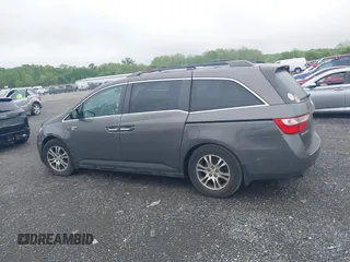 2012 Honda Odyssey EX-L with VIN 5FNRL5H64CB060468, listed as a IAAI auction lot 42182501 with 236,399 mi miles and . Bid and sale history available at carsss.com. Image 14.