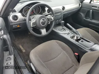 2009 Mazda MX-5 Miata Grand Touring z VIN JM1NC25F090202047, wystawiony jako Copart lot #55810505 z przebiegiem 91 618 mil mil oraz Szkody całkowita. Historia ofert i sprzedaży dostępna na DreamBid. Obrazek 8.