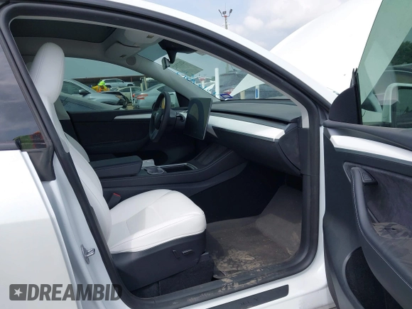 2023 Tesla Model Y Long Range with VIN 7SAYGAEEXPF776370, listed as a IAAI auction lot 42127512 with 27,120 mi miles and . Bid and sale history available at DreamBid. Image 5.