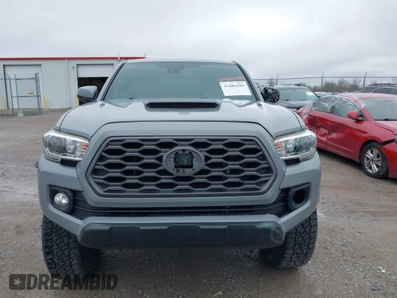 2021 Toyota Tacoma SR z VIN 3TMCZ5AN5MM372821, wystawiony jako IAAI lot #41886586 z przebiegiem 68 878 mil mil oraz . Historia ofert i sprzedaży dostępna na DreamBid. Obrazek 12.