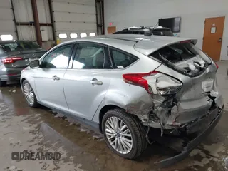 2018 Ford Focus Titanium with VIN 1FADP3N25JL261736, listed as a IAAI auction lot 41032128 with 59,142 mi miles and . Bid and sale history available at DreamBid. Image 3.