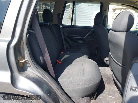 2003 Jeep Grand Cherokee Laredo with VIN 1J4GX48S53C504225, listed as a IAAI auction lot 41879669 with 247,246 mi miles. Bid and sale history available at carsss.com. Image 8.