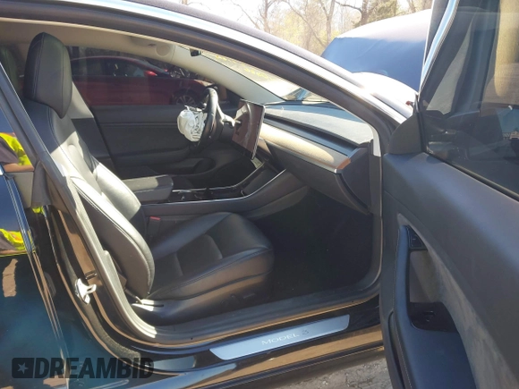 2019 Tesla Model 3 Mid Range with VIN 5YJ3E1EA2KF306286, listed as a IAAI auction lot 41699127 with 56,249 mi miles and . Bid and sale history available at DreamBid. Image 5.