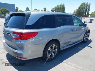 2018 Honda Odyssey Touring with VIN 5FNRL6H81JB022975, listed as a IAAI auction lot 42653304 with 210,137 mi miles and . Bid and sale history available at DreamBid. Image 4.