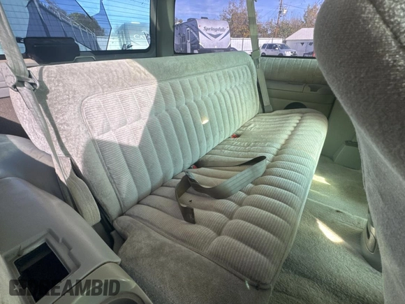 1993 GMC Yukon with VIN 1GKEK18K9PJ718702, listed as a Copart auction lot 82847154 with 103,848 mi miles and Clean Title. Bid and sale history available at carsss.com. Image 6.