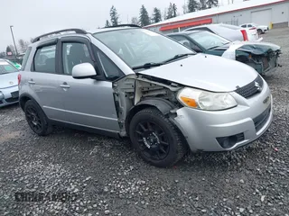 2010 Suzuki SX4 with VIN JS2YB5A3XA6300216, listed as a IAAI auction lot 41869046 with 129,709 mi miles. Bid and sale history available at carsss.com. Image 1.