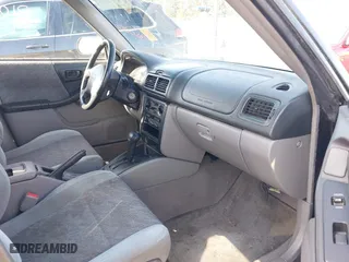 1999 Subaru Forester L with VIN JF1SF6351XH716957, listed as a IAAI auction lot 41969521 with 253,696 mi miles. Bid and sale history available at carsss.com. Image 5.
