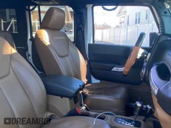 2014 Jeep Wrangler Unlimited Sahara with VIN 1C4BJWEG1EL272951, listed as a Copart auction lot 52157145 with 56,989 mi miles and Clean Title. Bid and sale history available at carsss.com. Image 5.