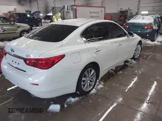 2015 Infiniti Q50 Premium z VIN JN1BV7AR0FM417283, wystawiony jako IAAI lot #41579549 z przebiegiem 112 407 mil mil oraz . Historia ofert i sprzedaży dostępna na DreamBid. Obrazek 4.