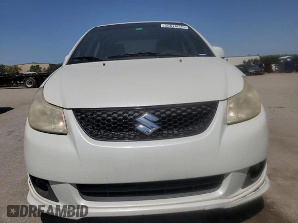 2009 Suzuki SX4 z VIN JS2YC416396200021, wystawiony jako Copart lot #56676075 z przebiegiem 150 981 mil mil oraz Szkoda całkowita • Salvage title. Historia ofert i sprzedaży dostępna na DreamBid. Obrazek 5.