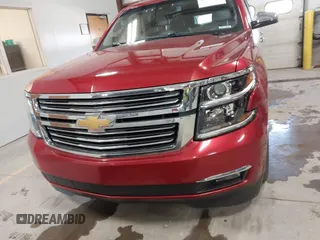 2015 Chevrolet Suburban LTZ z VIN 1GNSKKKC7FR218034, wystawiony jako IAAI lot #41884644 z przebiegiem 160 721 mil mil oraz . Historia ofert i sprzedaży dostępna na DreamBid. Obrazek 12.