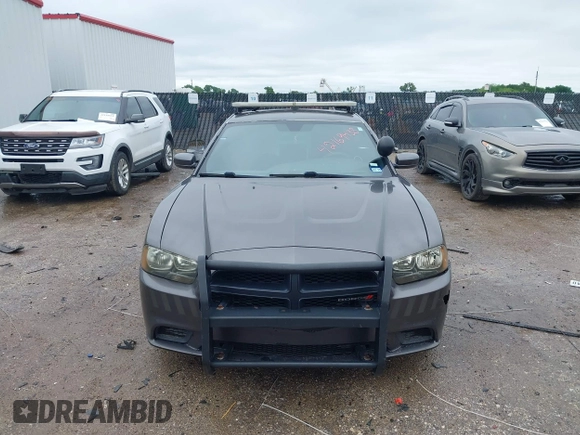 2013 Dodge Charger Police z VIN 2C3CDXAT4DH521778, wystawiony jako IAAI lot #42169438 z przebiegiem 191 907 mil mil oraz . Historia ofert i sprzedaży dostępna na DreamBid. Obrazek 12.