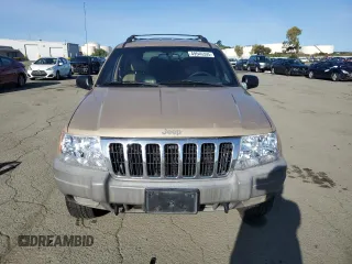 1999 Jeep Grand Cherokee Laredo z VIN 1J4GW58NXXC704719, wystawiony jako Copart lot #49546395 z przebiegiem 276 716 mil mil oraz Czysty tytuł • Clean title. Historia ofert i sprzedaży dostępna na DreamBid. Obrazek 5.