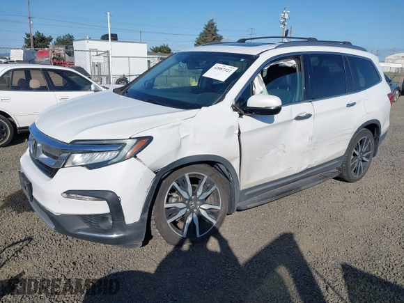 2021 Honda Pilot Touring 8-Passenger with VIN 5FNYF6H92MB031782, listed as a IAAI auction lot 42087322 with 70,062 mi miles and . Bid and sale history available at DreamBid. Image 2.