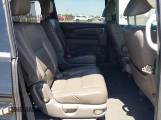 2014 Honda Odyssey Touring with VIN 5FNRL5H99EB133864, listed as a IAAI auction lot 42201359 with 122,490 mi miles and . Bid and sale history available at DreamBid. Image 8.