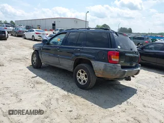 2000 Jeep Grand Cherokee Laredo with VIN 1J4G248SXYC365442, listed as a IAAI auction lot 42285521 with Not provided miles and . Bid and sale history available at DreamBid. Image 3.