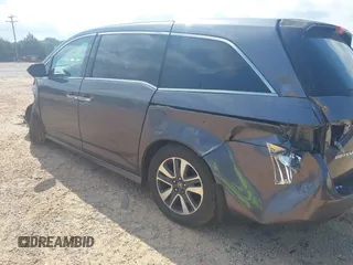 2015 Honda Odyssey Touring Elite with VIN 5FNRL5H95FB127156, listed as a IAAI auction lot 42618059 with 160,074 mi miles and . Bid and sale history available at DreamBid. Image 3.