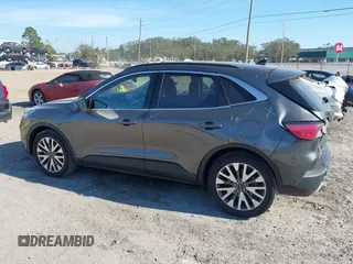 2020 Ford Escape Titanium with VIN 1FMCU9J9XLUA66440, listed as a IAAI auction lot 41464049 with 57,626 mi miles and . Bid and sale history available at DreamBid. Image 14.