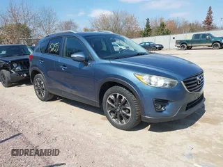 2016 Mazda CX-5 Grand Touring z VIN JM3KE4DY6G0785255, wystawiony jako IAAI lot #41887066 z przebiegiem 171 334 mil mil oraz . Historia ofert i sprzedaży dostępna na DreamBid. Obrazek 1.