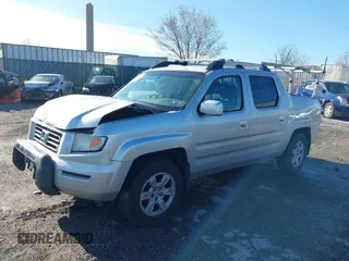2006 Honda Ridgeline RTL z VIN 2HJYK165X6H570027, wystawiony jako IAAI lot #41868389 z przebiegiem 207 020 mil mil oraz . Historia ofert i sprzedaży dostępna na DreamBid. Obrazek 17.