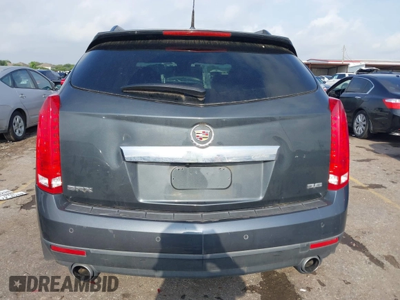 2012 Cadillac SRX Luxury Collection z VIN 3GYFNAE39CS659562, wystawiony jako IAAI lot #42109525 z przebiegiem 151 051 mil mil oraz . Historia ofert i sprzedaży dostępna na DreamBid. Obrazek 16.