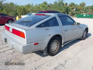 1987 Nissan 300ZX z VIN JN1HZ14S6HX214121, wystawiony jako IAAI lot #42204712 z przebiegiem 218 637 mil mil oraz . Historia ofert i sprzedaży dostępna na DreamBid. Obrazek 4.