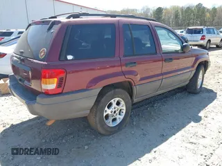 2003 Jeep Grand Cherokee Laredo with VIN 1J4GX48S93C523831, listed as a IAAI auction lot 41852442 with 270,735 mi miles. Bid and sale history available at carsss.com. Image 4.