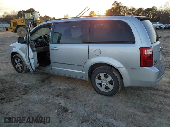 2010 Dodge Grand Caravan SXT with VIN 2D4RN5D16AR496795, listed as a Copart auction lot 83374834 with 99,902 mi miles and Salvage Title. Bid and sale history available at DreamBid. Image 2.