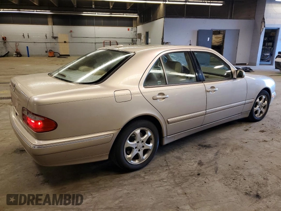 2002 Mercedes-Benz E-Class with VIN WDBJF65J12B485293, listed as a Copart auction lot 77561984 with 140,708 mi miles and Salvage Title. Bid and sale history available at carsss.com. Image 3.