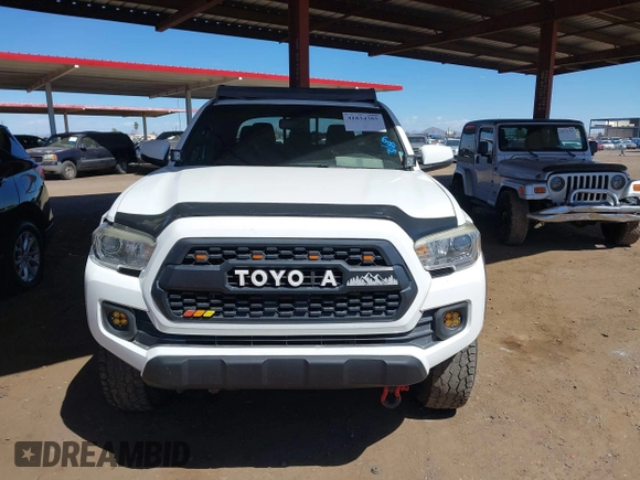 2016 Toyota Tacoma SR with VIN 5TFCZ5ANXGX028464, listed as a IAAI auction lot 41834385 with 124,407 mi miles and . Bid and sale history available at DreamBid. Image 11.