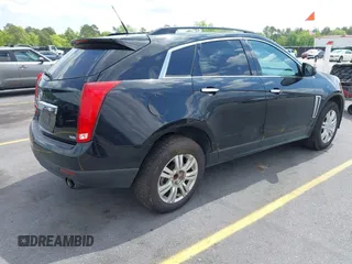 2014 Cadillac SRX with VIN 3GYFNAE30ES641616, listed as a IAAI auction lot 42000120 with 145,000 mi miles and . Bid and sale history available at DreamBid. Image 4.
