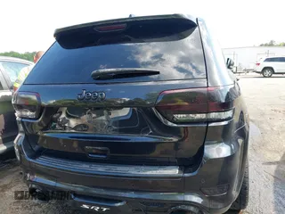 2014 Jeep Grand Cherokee SRT-8 z VIN 1C4RJFDJ2EC174412, wystawiony jako IAAI lot #42116541 z przebiegiem 124 693 mil mil oraz . Historia ofert i sprzedaży dostępna na DreamBid. Obrazek 16.