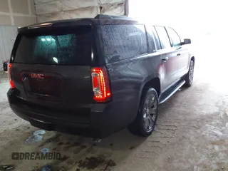 2015 GMC Yukon XL SLT with VIN 1GKS2HKC6FR667110, listed as a IAAI auction lot 41472250 with 141,383 mi miles. Bid and sale history available at carsss.com. Image 4.