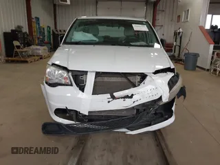 2014 Dodge Grand Caravan American Value with VIN 2C4RDGBG7ER345277, listed as a IAAI auction lot 42061355 with 145,889 mi miles and . Bid and sale history available at DreamBid. Image 12.