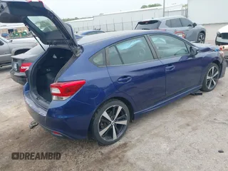 2017 Subaru Impreza Special Sports z VIN 4S3GTAM62H3700557, wystawiony jako IAAI lot #42055439 z przebiegiem 94 920 mil mil oraz . Historia ofert i sprzedaży dostępna na DreamBid. Obrazek 4.