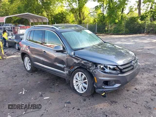2013 Volkswagen Tiguan S with VIN WVGAV3AX7DW624136, listed as a IAAI auction lot 42256657 with 124,000 mi miles and . Bid and sale history available at DreamBid. Image 1.