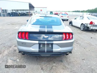 2021 Ford Mustang EcoBoost z VIN 1FA6P8TH1M5121107, wystawiony jako IAAI lot #42204097 z przebiegiem 51 542 mil mil oraz . Historia ofert i sprzedaży dostępna na DreamBid. Obrazek 16.