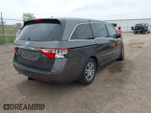 2011 Honda Odyssey EX-L with VIN 5FNRL5H68BB100274, listed as a IAAI auction lot 42159787 with 205,616 mi miles and . Bid and sale history available at carsss.com. Image 4.