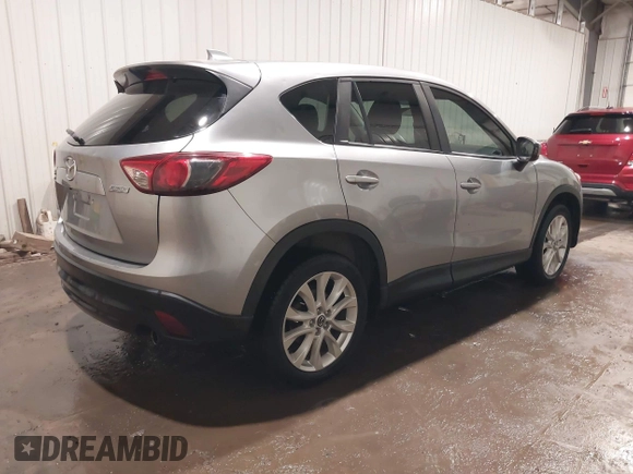 2013 Mazda CX-5 Grand Touring with VIN JM3KE4DE8D0106118, listed as a IAAI auction lot 41395950 with 204,832 mi miles. Bid and sale history available at carsss.com. Image 4.