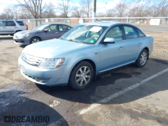 2008 Ford Taurus SEL with VIN 1FAHP27WX8G157077, listed as a IAAI auction lot 41499882 with 113,039 mi miles. Bid and sale history available at carsss.com. Image 2.