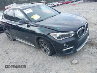 2017 BMW X1 sDrive28i with VIN WBXHU7C36HP924874, listed as a IAAI auction lot 41368396 with 113,443 mi miles. Bid and sale history available at carsss.com. Image 1.