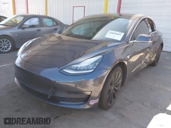 2018 Tesla Model 3 Long Range Battery with VIN 5YJ3E1EA7JF163401, listed as a IAAI auction lot 41829681 with 90,065 mi miles. Bid and sale history available at carsss.com. Image 2.