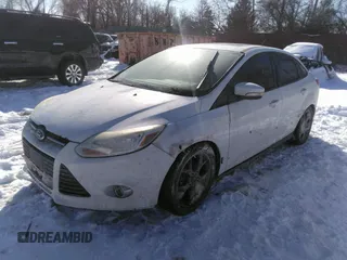 2013 Ford Focus SE z VIN 1FADP3F23DL337201, wystawiony jako IAAI lot #41630163 z przebiegiem 163 979 mil mil oraz . Historia ofert i sprzedaży dostępna na DreamBid. Obrazek 2.